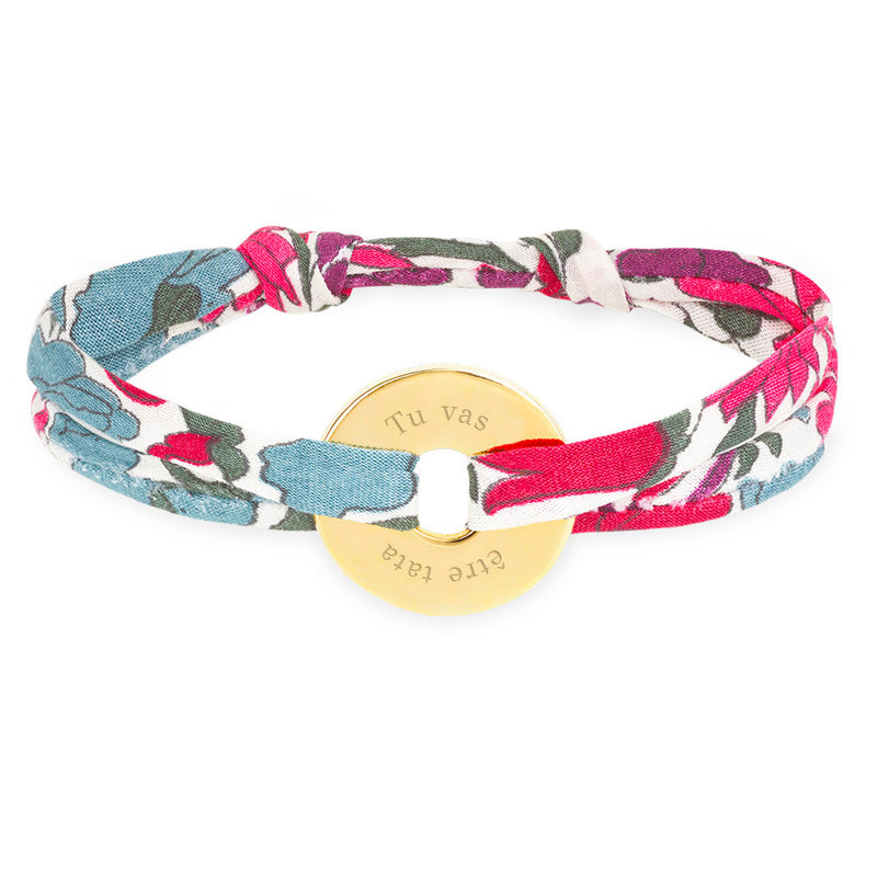 Un bracelet personnalisé en forme de cible, orné du liberty Jacinthe et plaqué or 15mm.