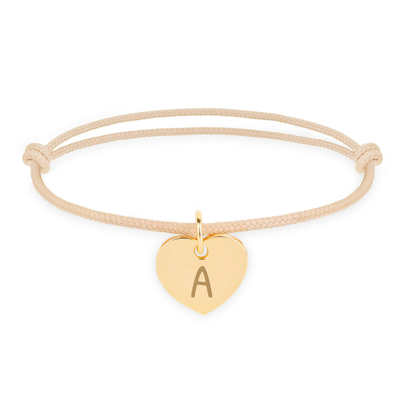 Bracelet personnalisé avec un cœur de 15mm en plaqué or, cordon beige.