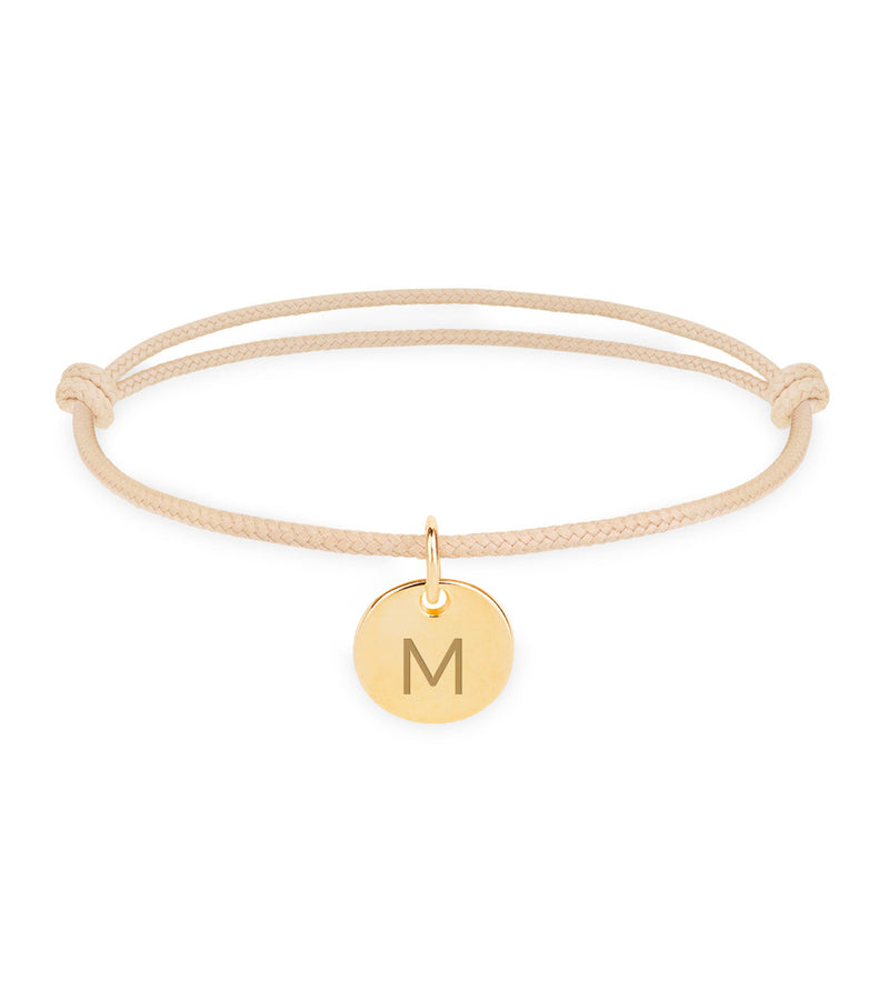 Médaille plaquée or 10mm sur un cordon beige, un bracelet personnalisé pour une touche de luxe.