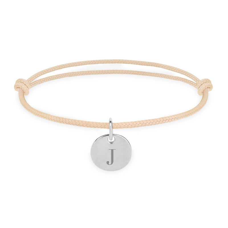 Bracelet argenté avec médaille de 10mm sur cordon beige.