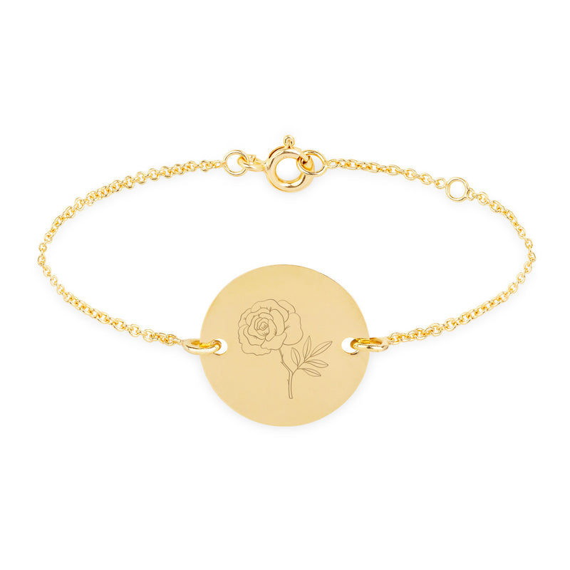 Une médaille en plaqué or, de 15mm de diamètre, dotée de deux trous, suspendue à une délicate chaîne maille.