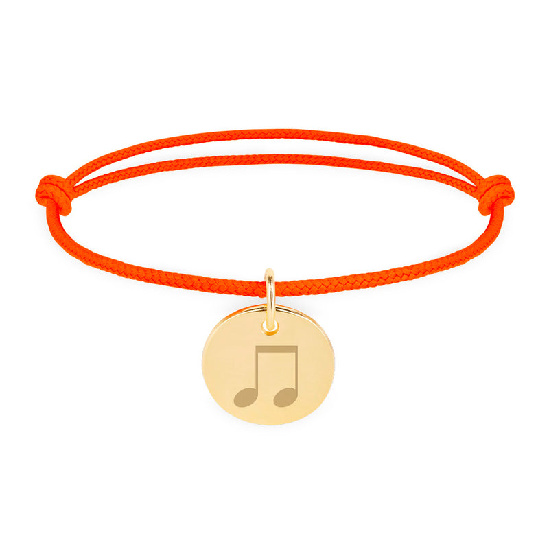 Un bracelet unique, personnalisé pour vous, avec une médaille plaquée or de 15mm et un cordon orange fluo.
