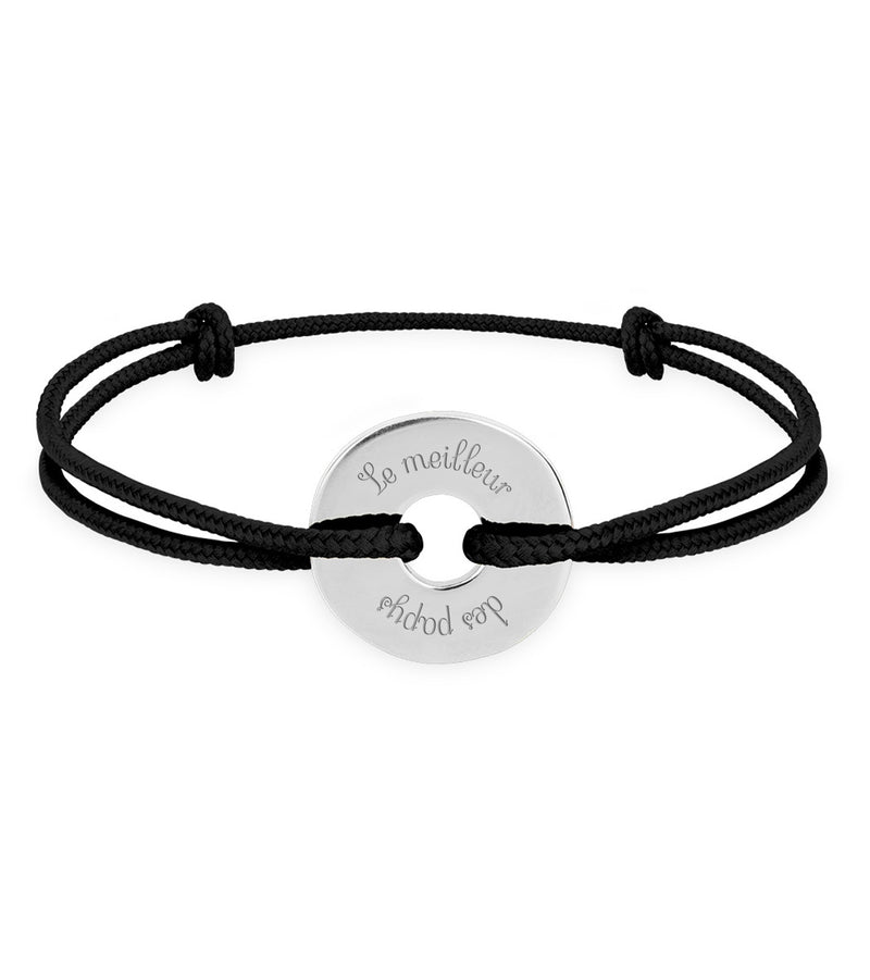 Un bracelet en forme de cible, personnalisé de 15mm en argent, avec un cordon noir.