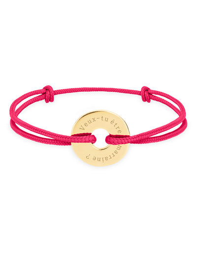 Personnalisé en 15mm, ce bracelet forme cible, plaqué or, est orné d'un cordon rose fuchsia.