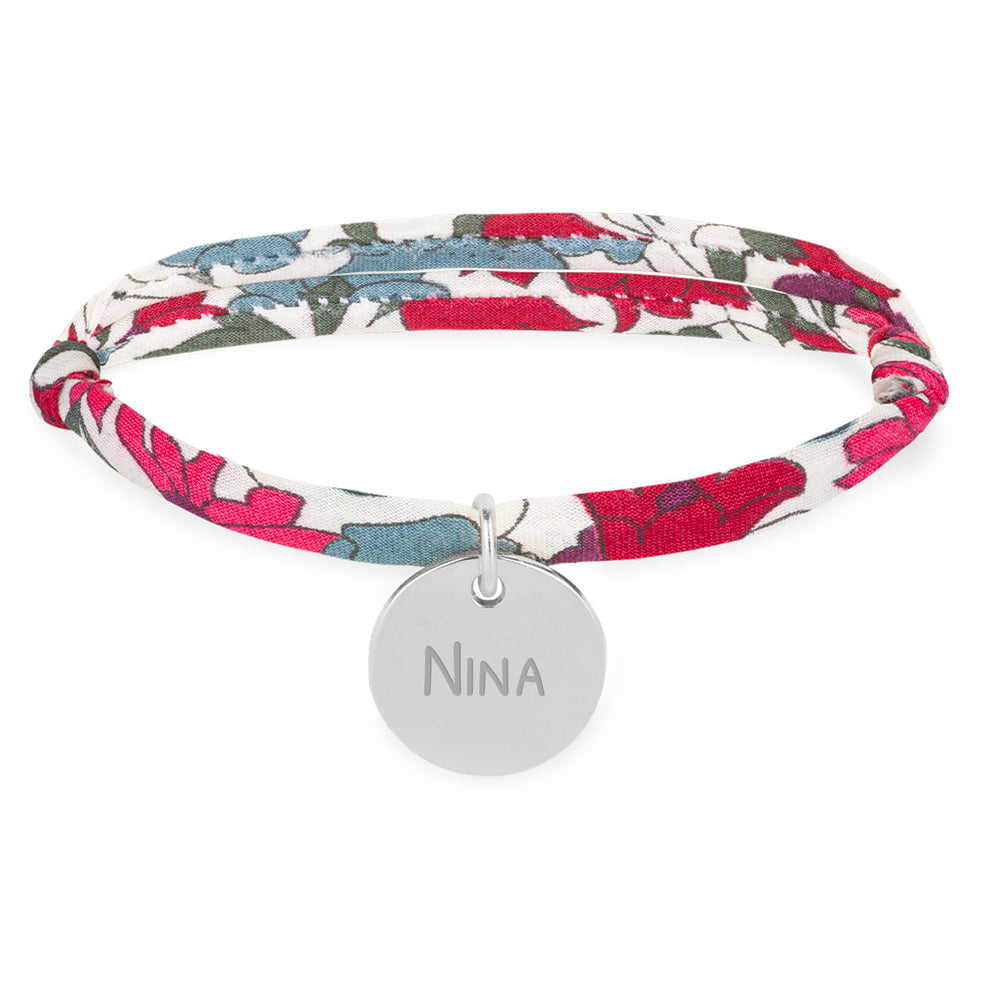 Un bracelet argenté personnalisé avec une médaille de 15mm, orné d'un lien Liberty Jacinthe.