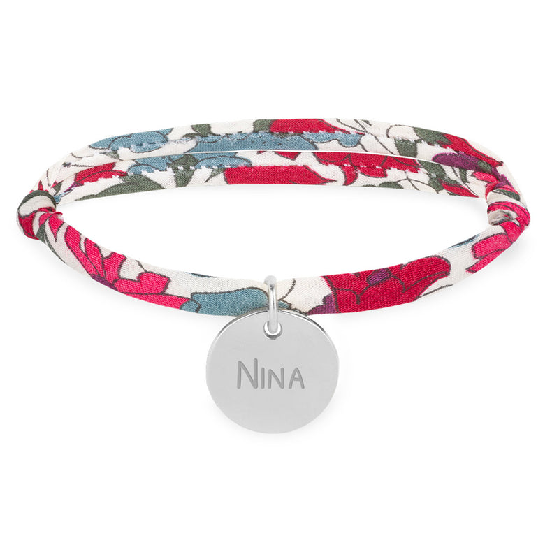 Un bracelet argenté personnalisé avec une médaille de 15mm, orné d'un lien Liberty Jacinthe.