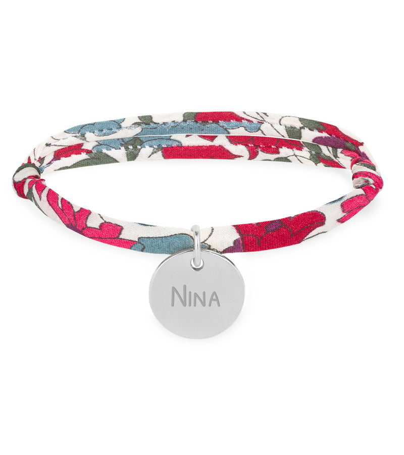 Un bracelet argenté personnalisé avec une médaille de 15mm, orné d'un lien Liberty Jacinthe.