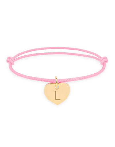 Bracelet en or avec un cœur, pour une touche d'élégance, avec un cordon rose.