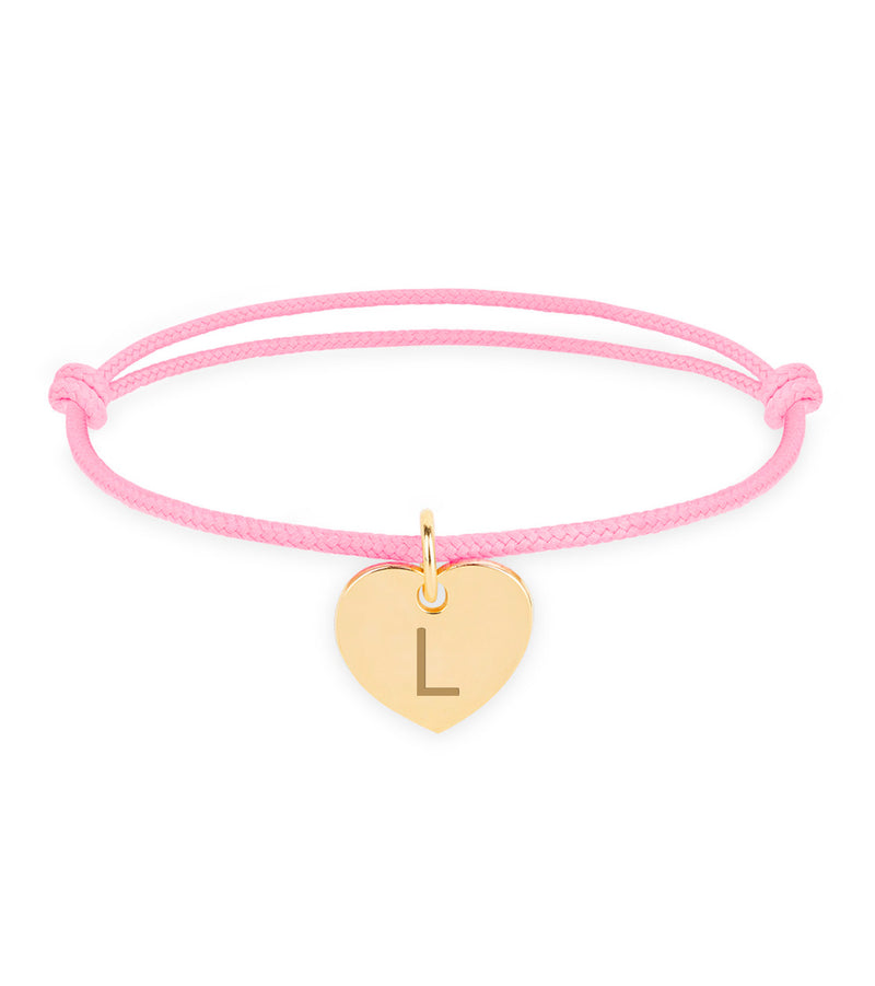 Bracelet en or avec un cœur, pour une touche d'élégance, avec un cordon rose.