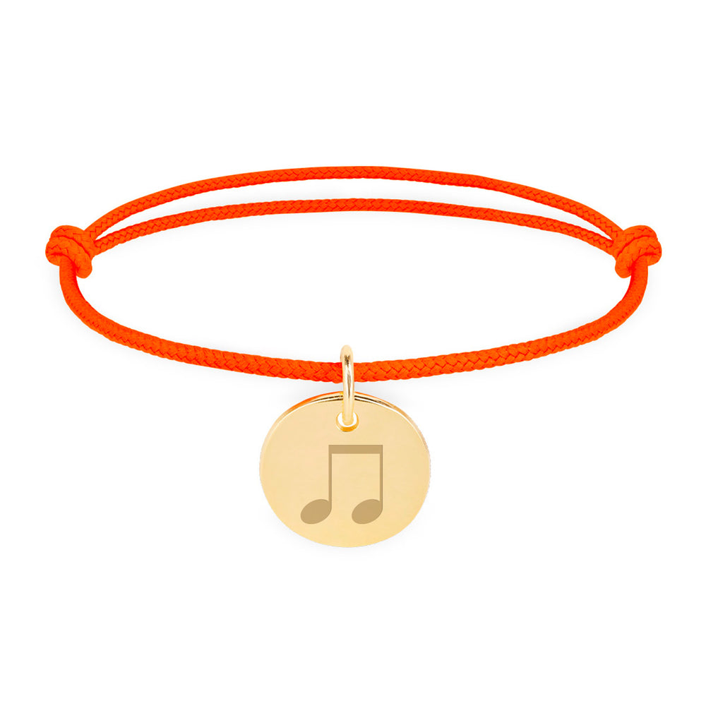 Un bracelet unique, personnalisé pour vous, avec une médaille plaquée or de 15mm et un cordon orange fluo.