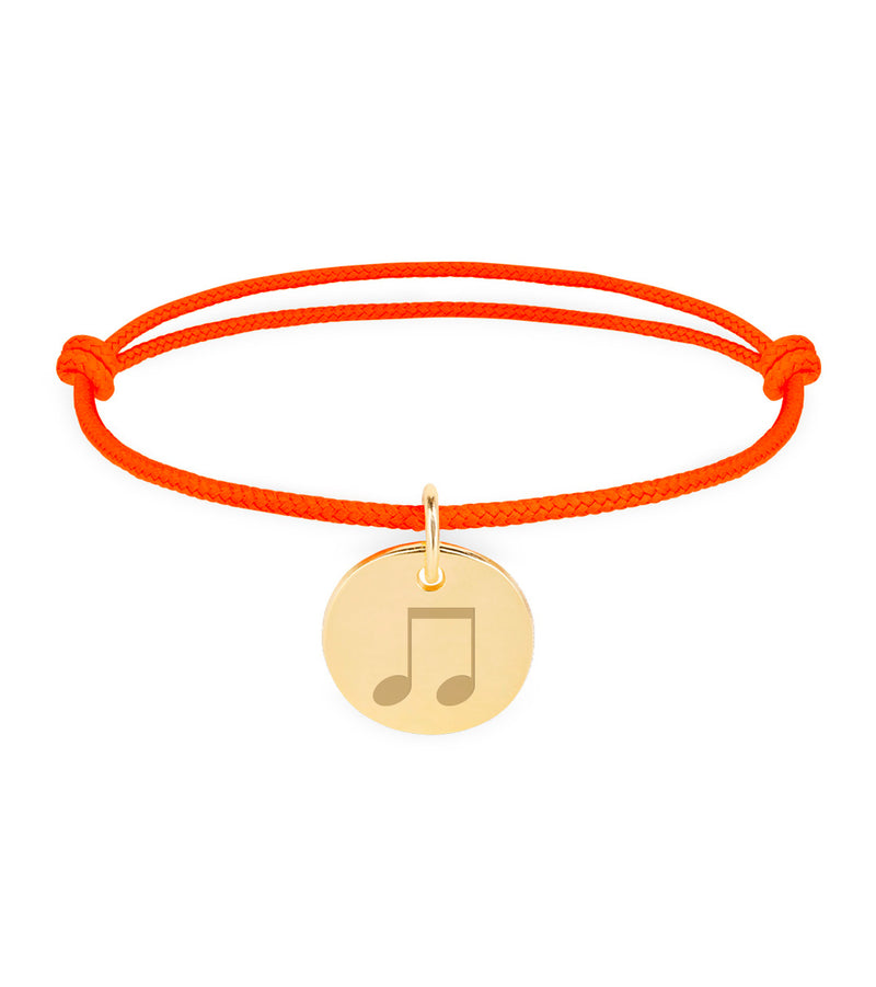 Un bracelet unique, personnalisé pour vous, avec une médaille plaquée or de 15mm et un cordon orange fluo.