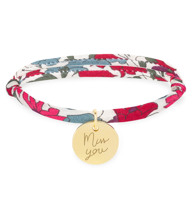 Dévoilez votre style avec ce magnifique Bracelet Personnalisé Médaille 15mm Plaqué Or, orné d'une ravissante médaille. Le lien Liberty Jacinthe ajoute une touche de couleur éclatante.